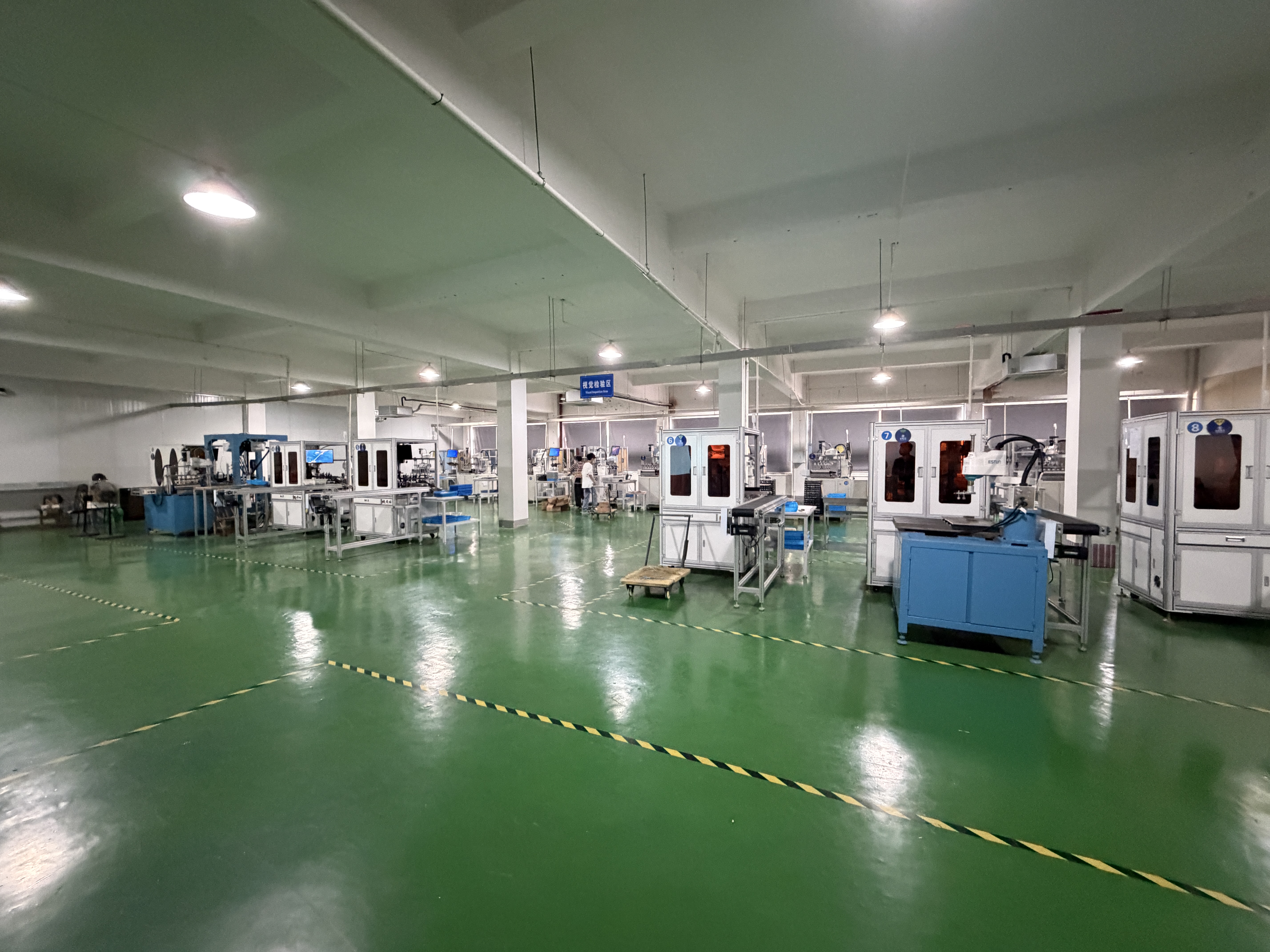 CNC and MIM production floor with automated machinery